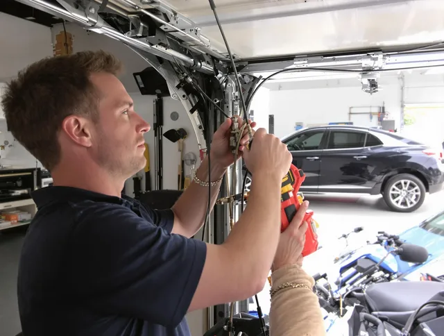 East Windsor Garage Door Repair safety certified technician performing cable replacement in East Windsor