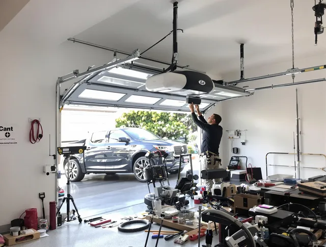 East Windsor Garage Door Repair specialist installing smart garage door opener system in East Windsor home