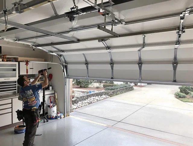 Garage door track repair service by East Windsor Garage Door Repair in East Windsor